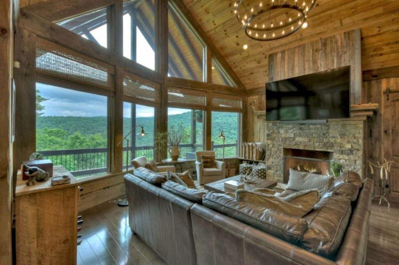 436 Geronimo Road Cherry Log, GA 30522 - Photo 8 of 72 a living room with fireplace furniture and a flat screen tv