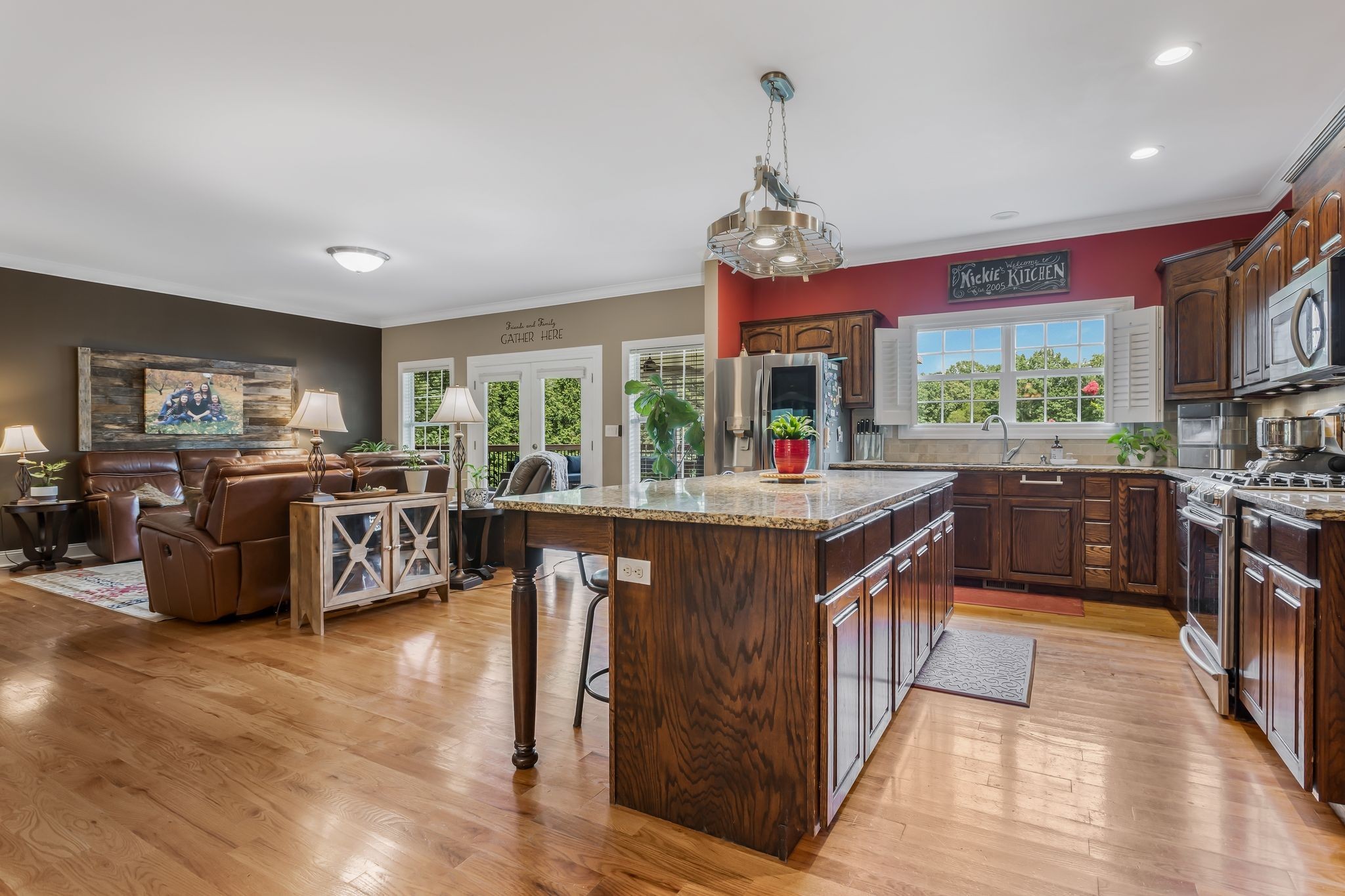 2350 Joe Brown Road Spring Hill, TN 37174 - Photo 28 of 80 a kitchen with stainless steel appliances granite countertop a stove a sink dishwasher and a flat screen tv