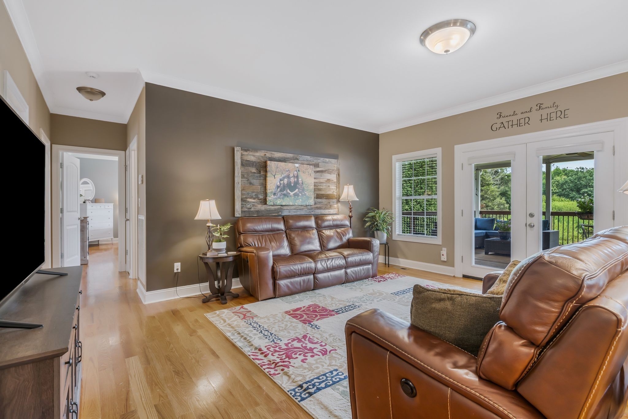 2350 Joe Brown Road Spring Hill, TN 37174 - Photo 29 of 80 a living room with furniture and a flat screen tv
