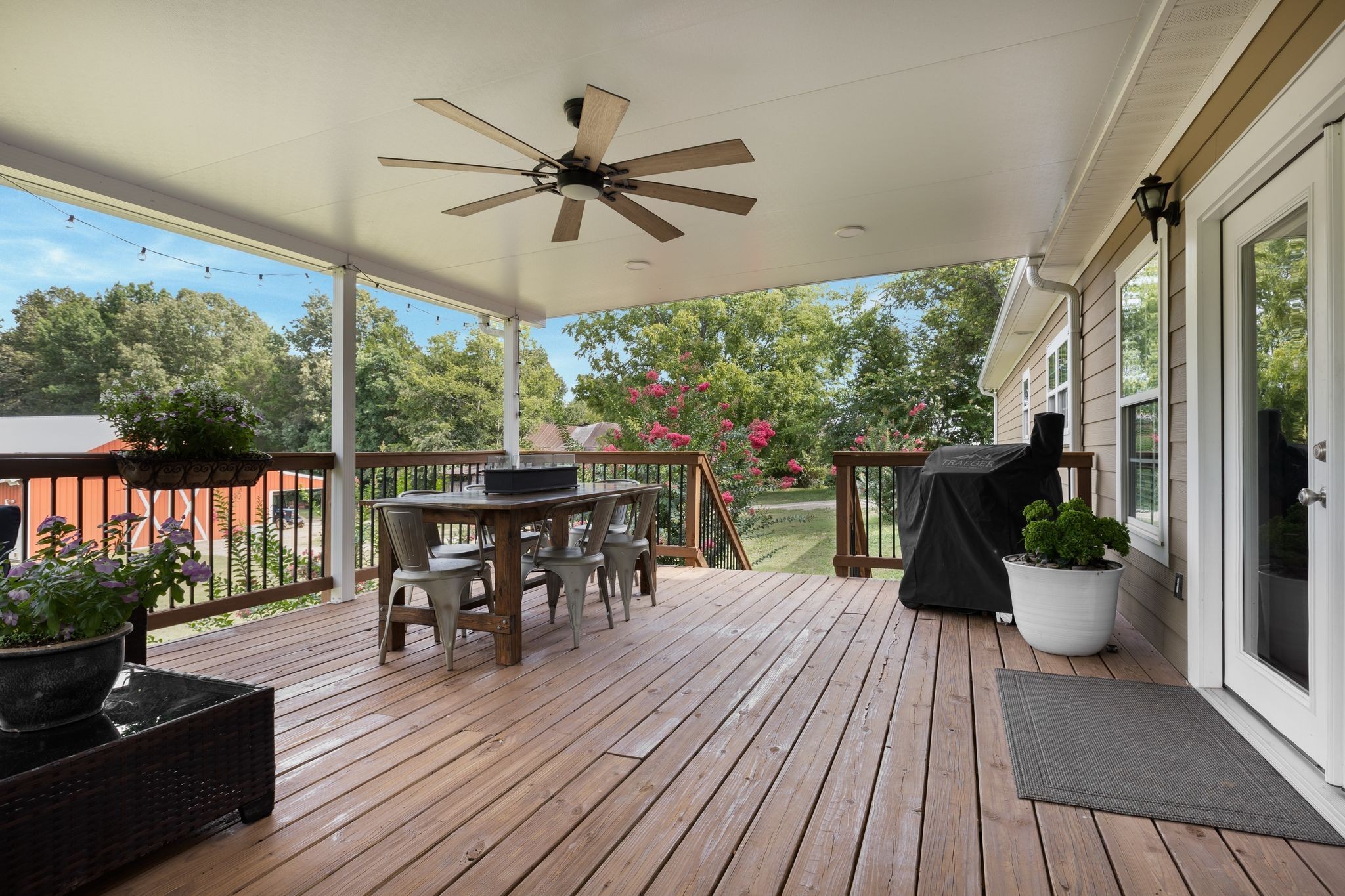 2350 Joe Brown Road Spring Hill, TN 37174 - Photo 48 of 80 a dining room with wooden floor a glass table and chairs