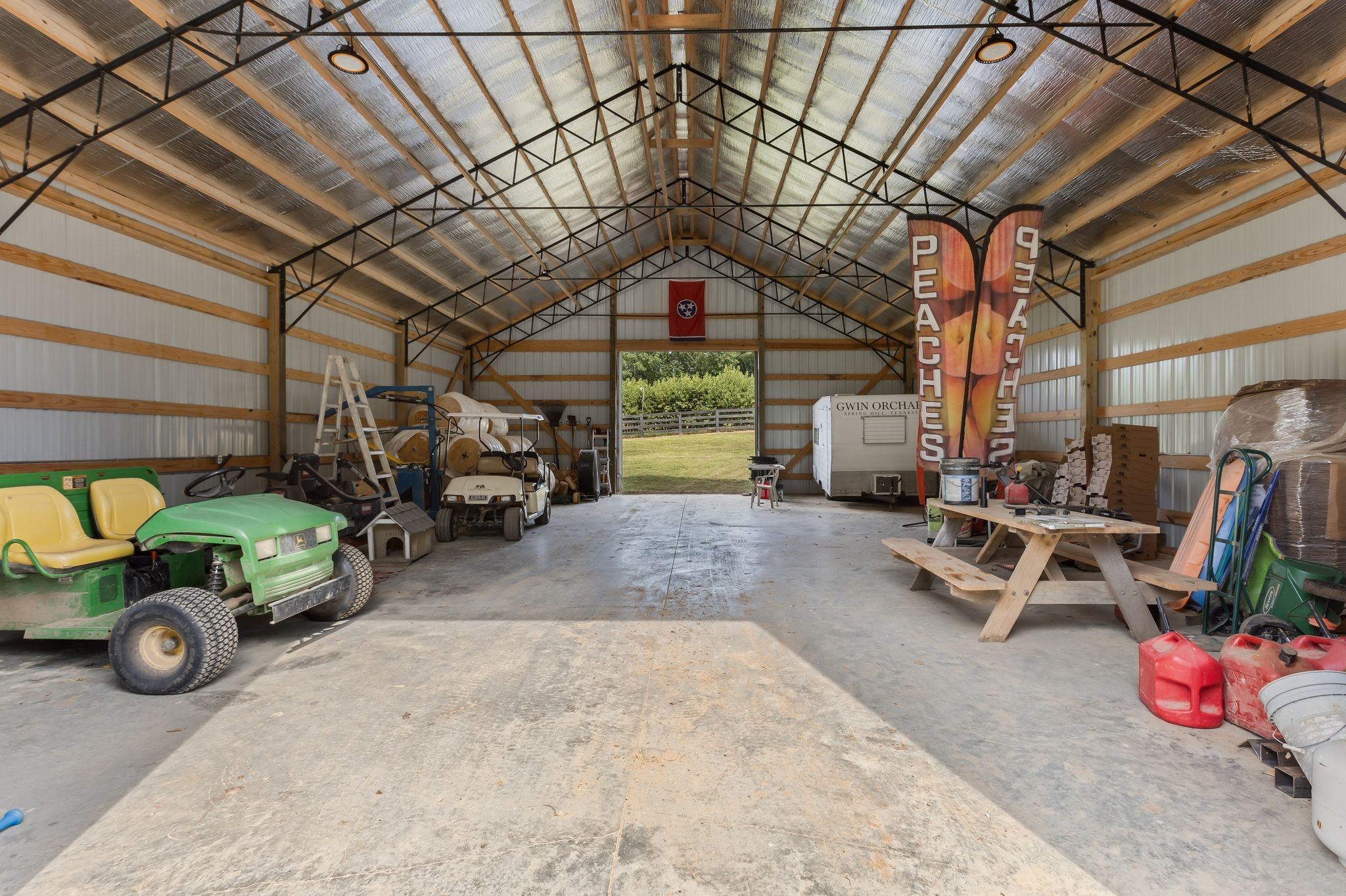 2350 Joe Brown Road Spring Hill, TN 37174 - Photo 56 of 80 a car and bike parked in a garage