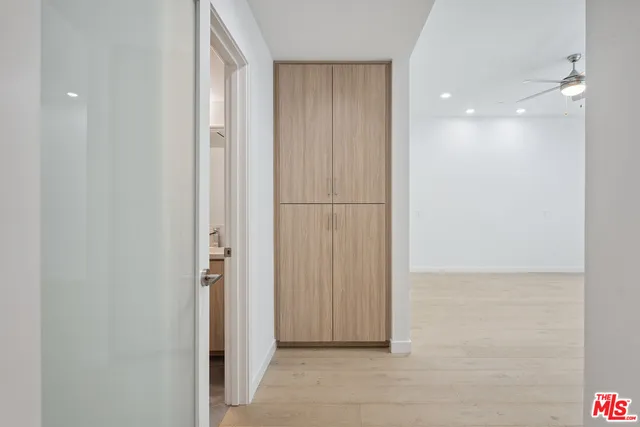 an empty room with fan and a ceiling fan