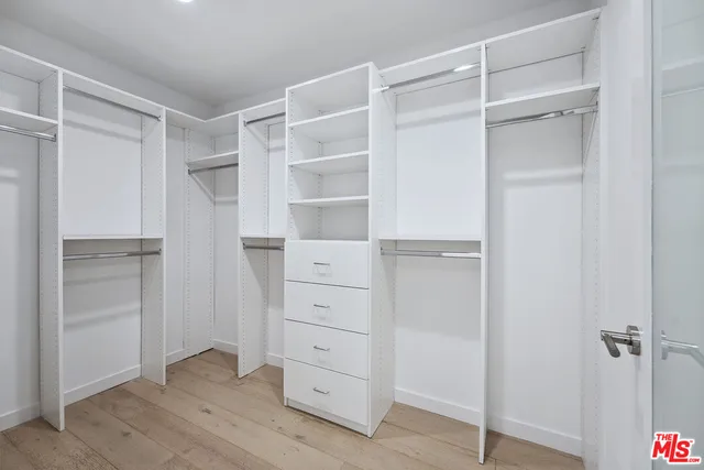 a spacious bathroom with a double vanity sink mirror and toilet