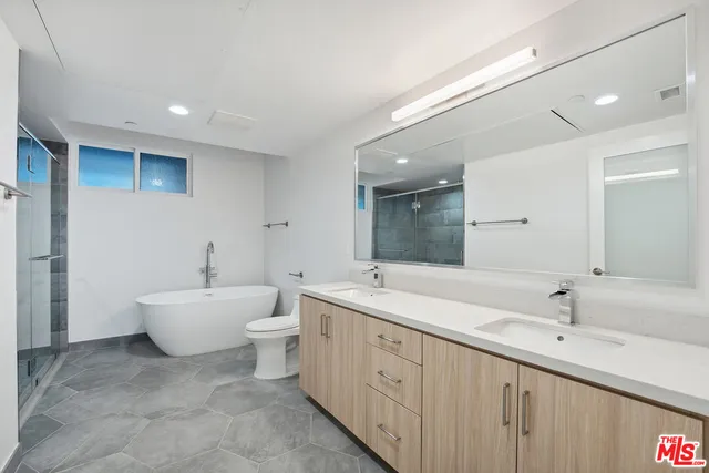 a bathroom with a bathtub and shower