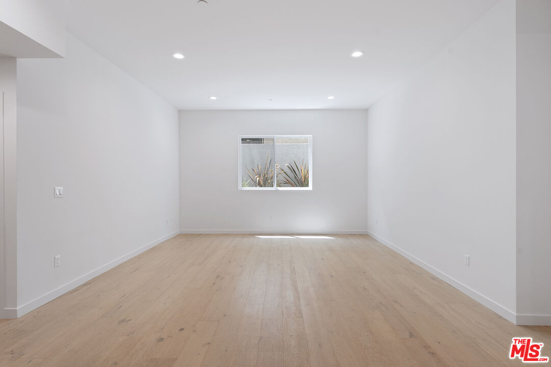 1746 Garfield Place, Unit 102 Los Angeles, CA 90028 - Photo 8 of 32 an empty room with a window