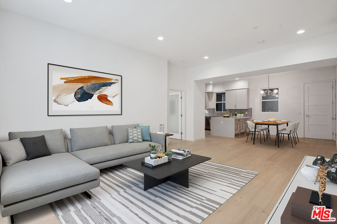 1746 Garfield Place, Unit 102 Los Angeles, CA 90028 - Photo 9 of 32 a living room with furniture and wooden floor