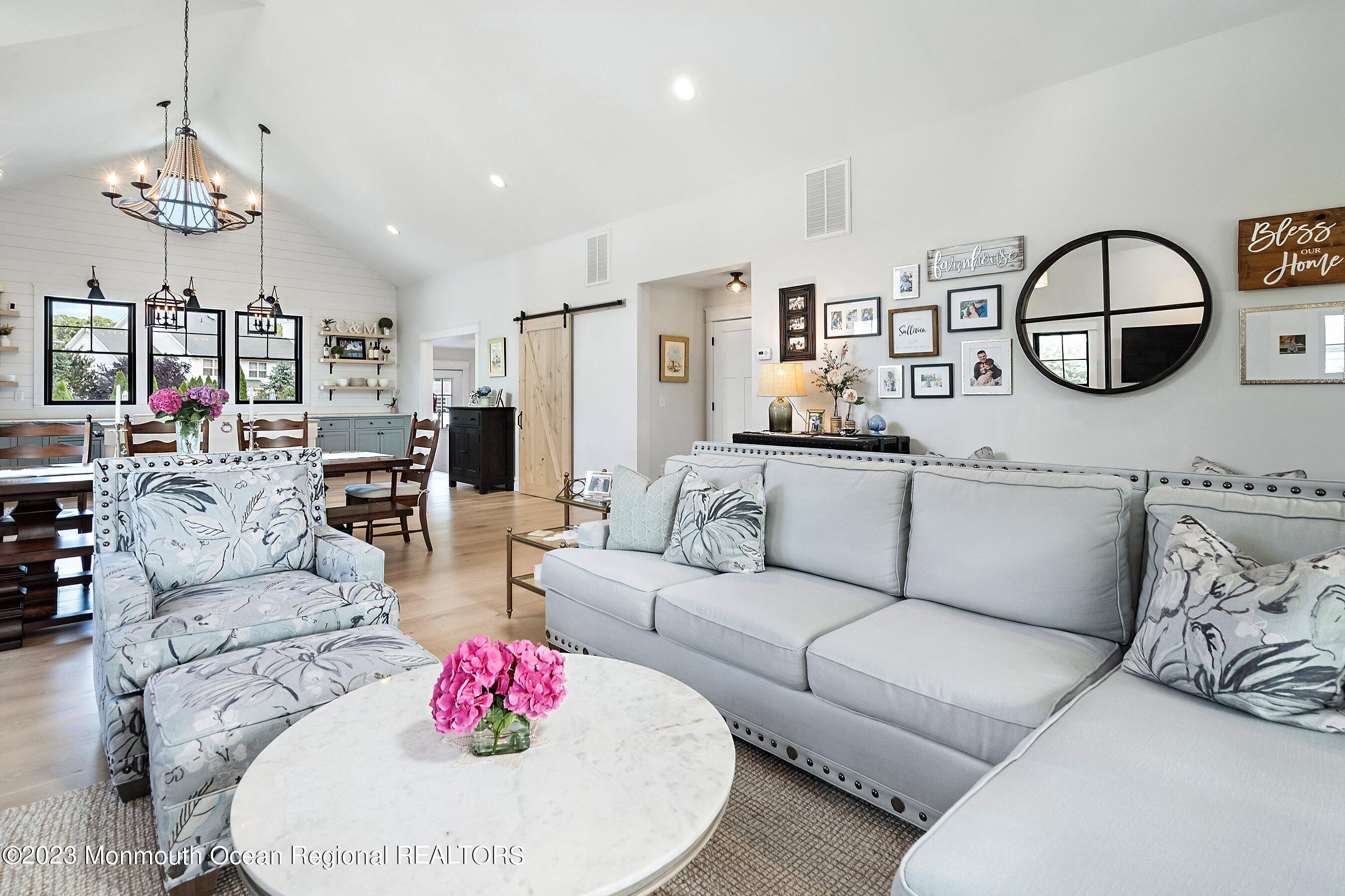 2502 Kipling Avenue Spring Lake, NJ 07762 - Photo 11 of 43 a living room with furniture and a chandelier