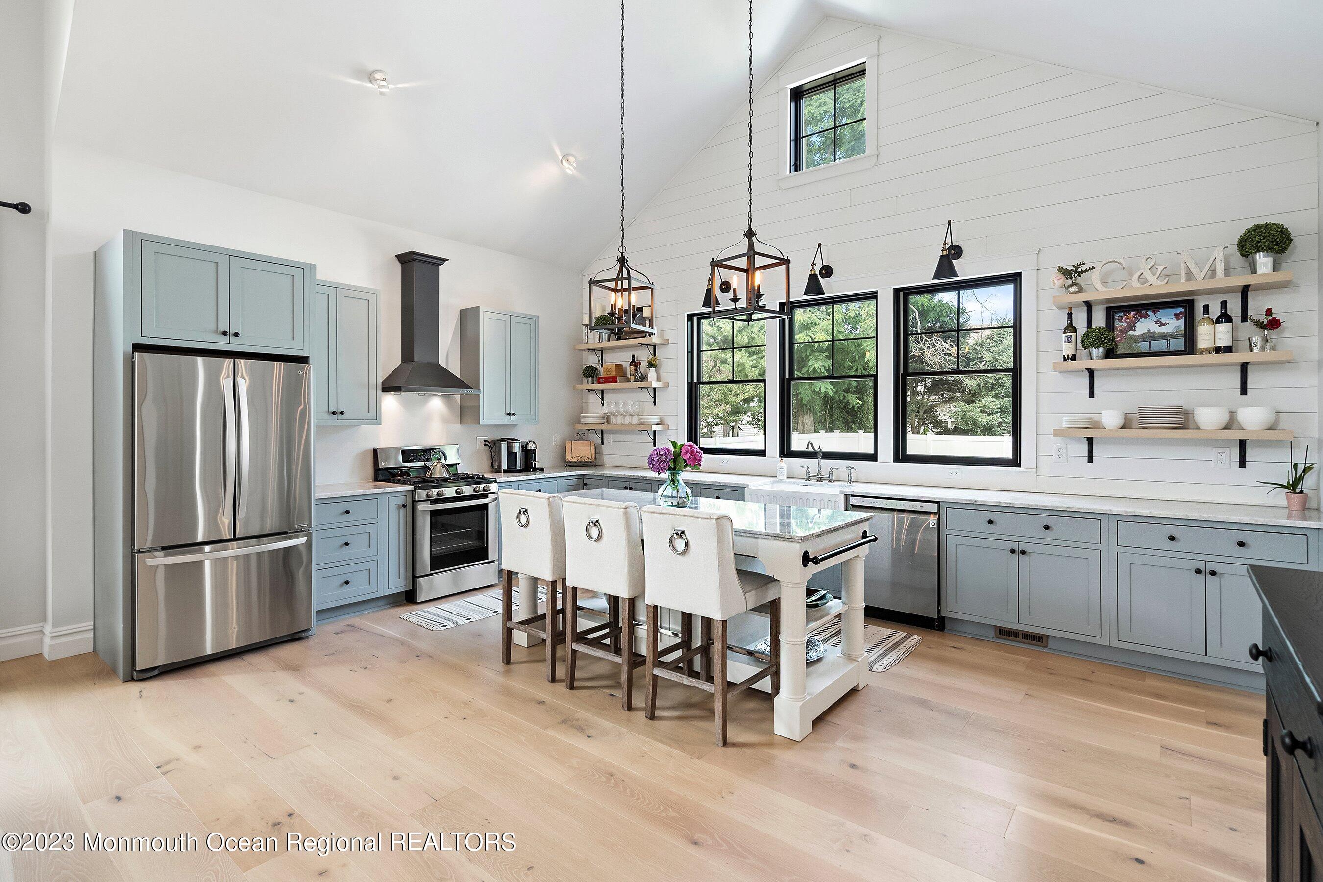 2502 Kipling Avenue Spring Lake, NJ 07762 - Photo 14 of 43 a kitchen with stainless steel appliances granite countertop a stove a sink and a refrigerator