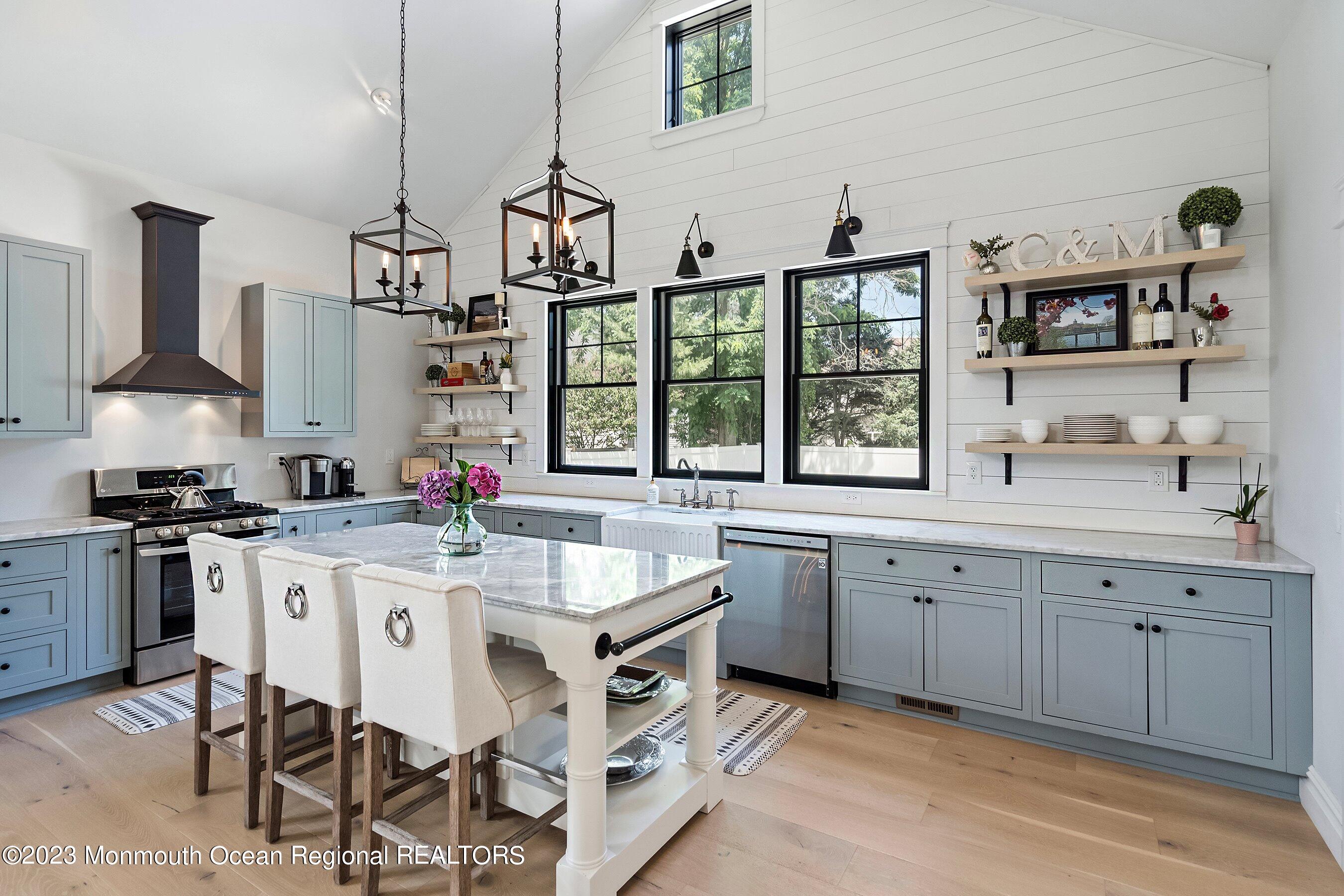 2502 Kipling Avenue Spring Lake, NJ 07762 - Photo 17 of 43 a kitchen with granite countertop a sink stove and cabinets