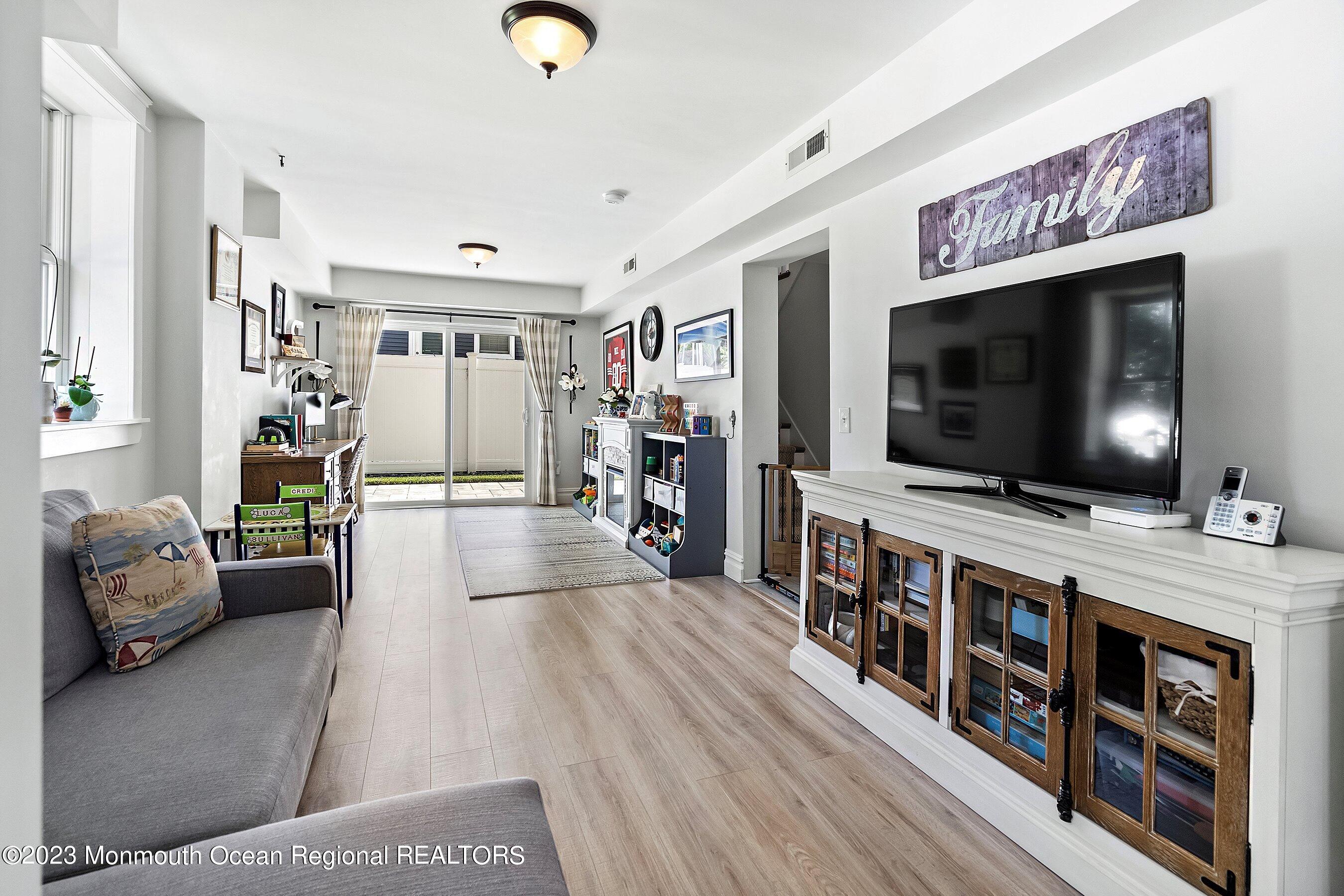 2502 Kipling Avenue Spring Lake, NJ 07762 - Photo 23 of 43 a living room with furniture and a flat screen tv