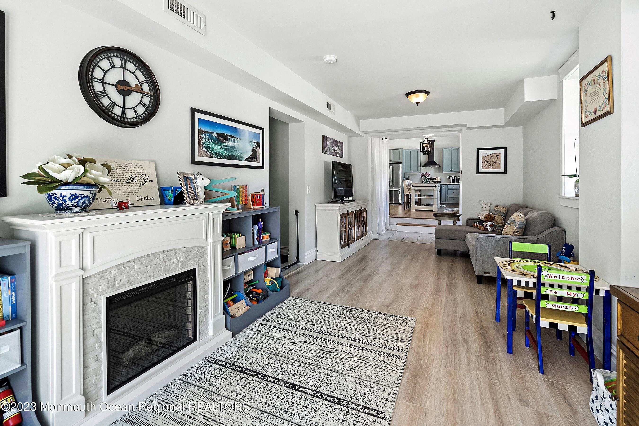 2502 Kipling Avenue Spring Lake, NJ 07762 - Photo 24 of 43 a living room with furniture and a fireplace