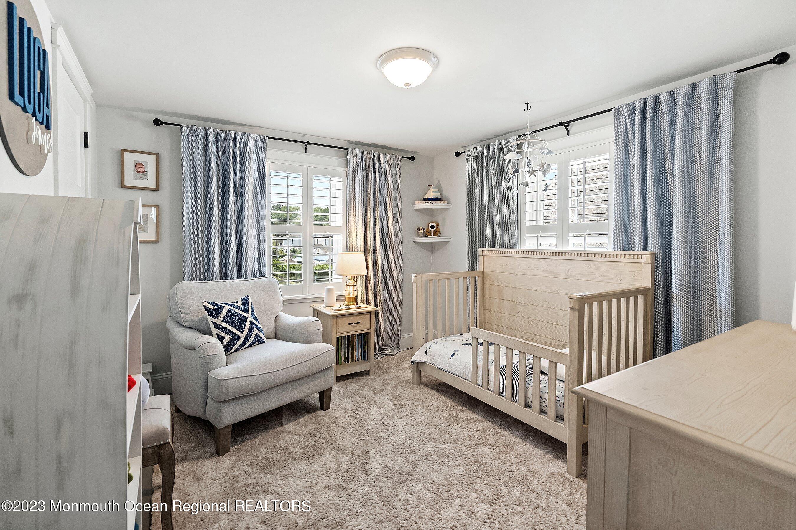 2502 Kipling Avenue Spring Lake, NJ 07762 - Photo 29 of 43 a bedroom with furniture and a large window