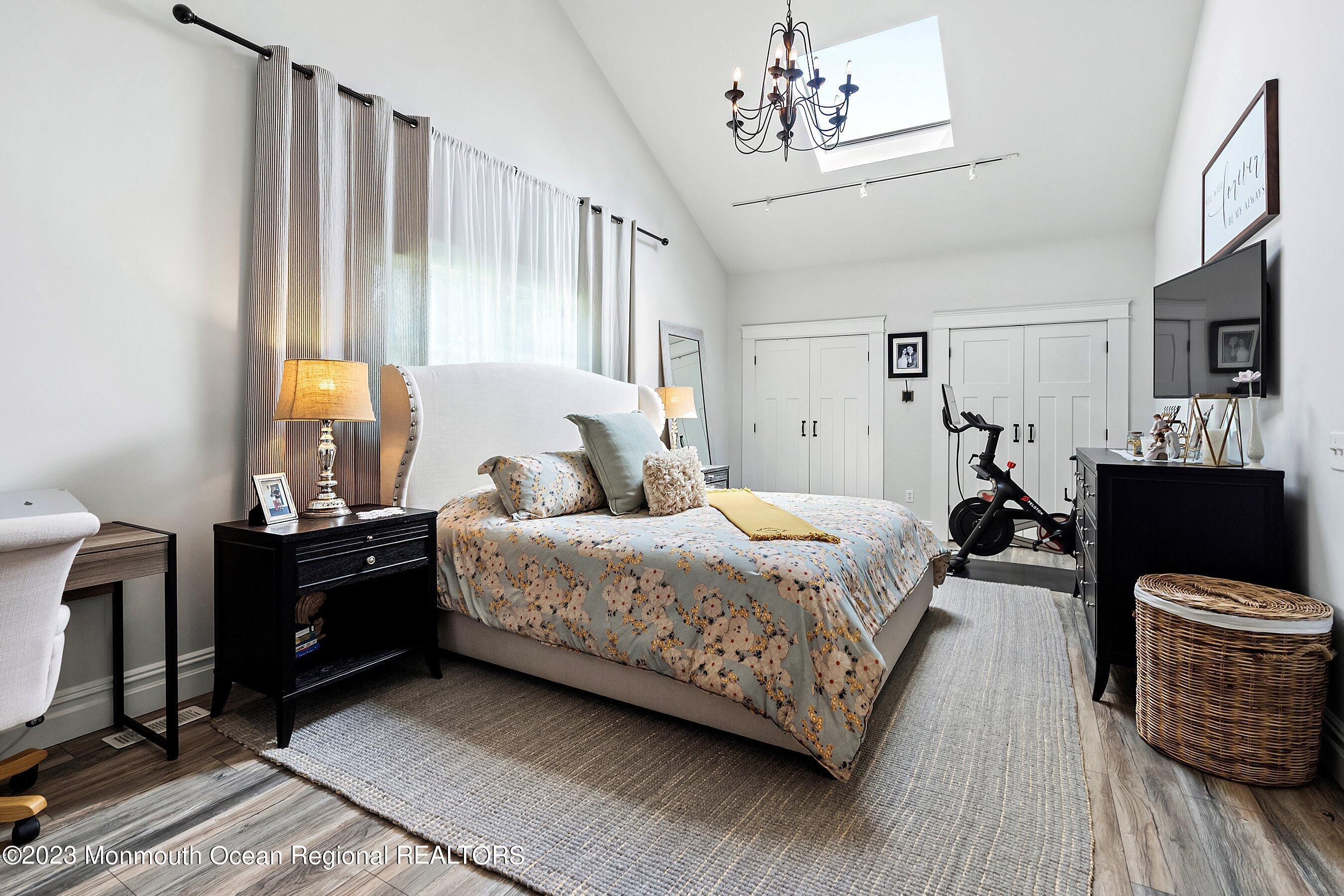 2502 Kipling Avenue Spring Lake, NJ 07762 - Photo 31 of 43 a bedroom with a bed and wooden floor