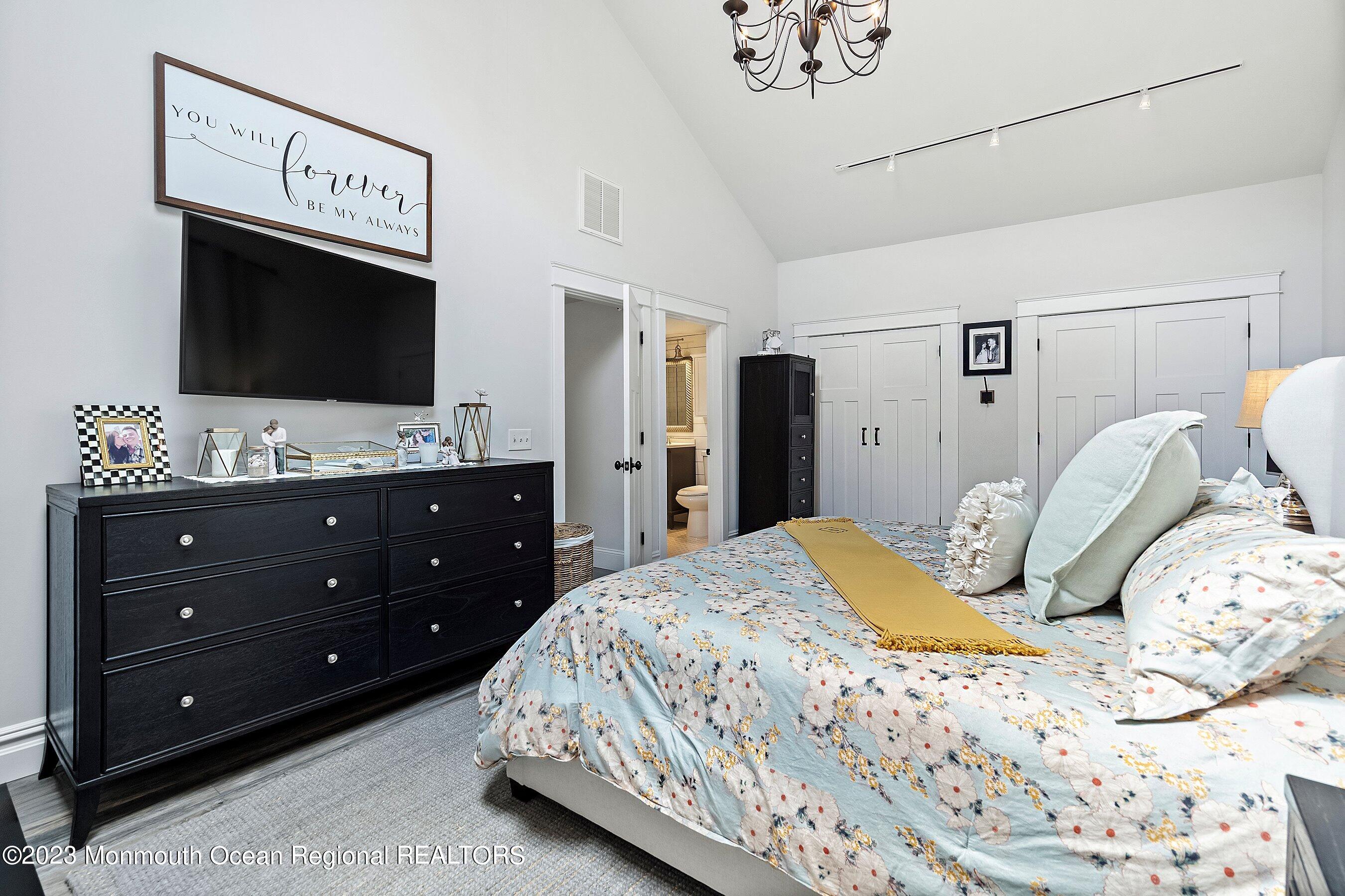 2502 Kipling Avenue Spring Lake, NJ 07762 - Photo 32 of 43 a bedroom with a bed and a flat screen tv