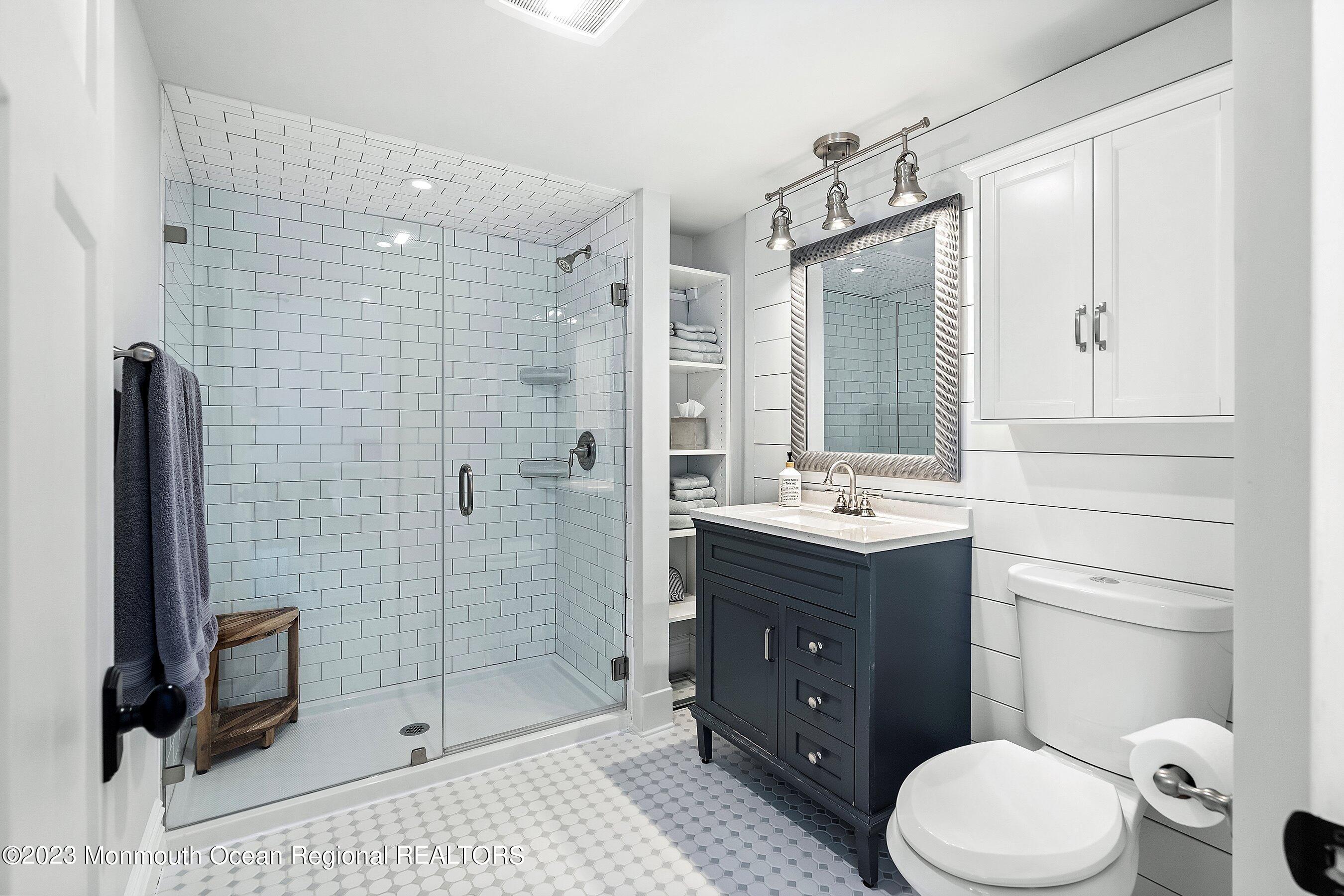 2502 Kipling Avenue Spring Lake, NJ 07762 - Photo 33 of 43 a bathroom with a sink a toilet and shower