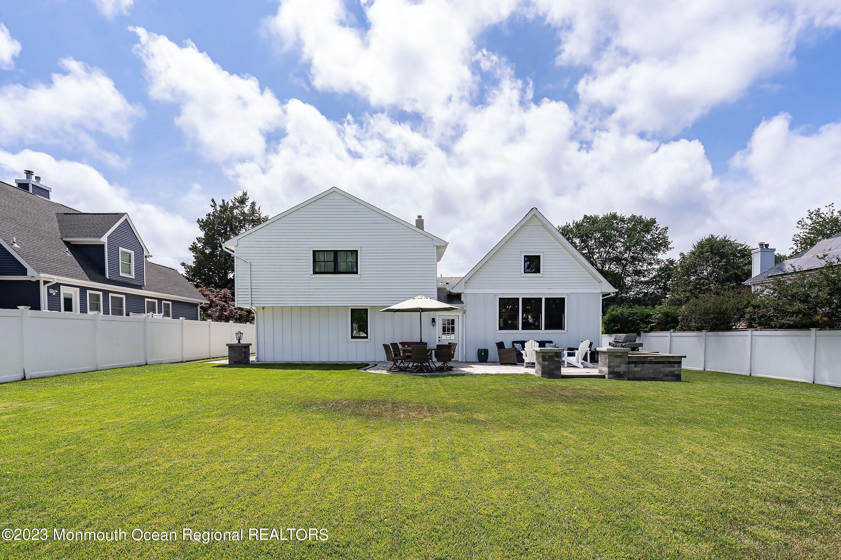 2502 Kipling Avenue Spring Lake, NJ 07762 - Photo 38 of 43 a front view of house with yard and car parked