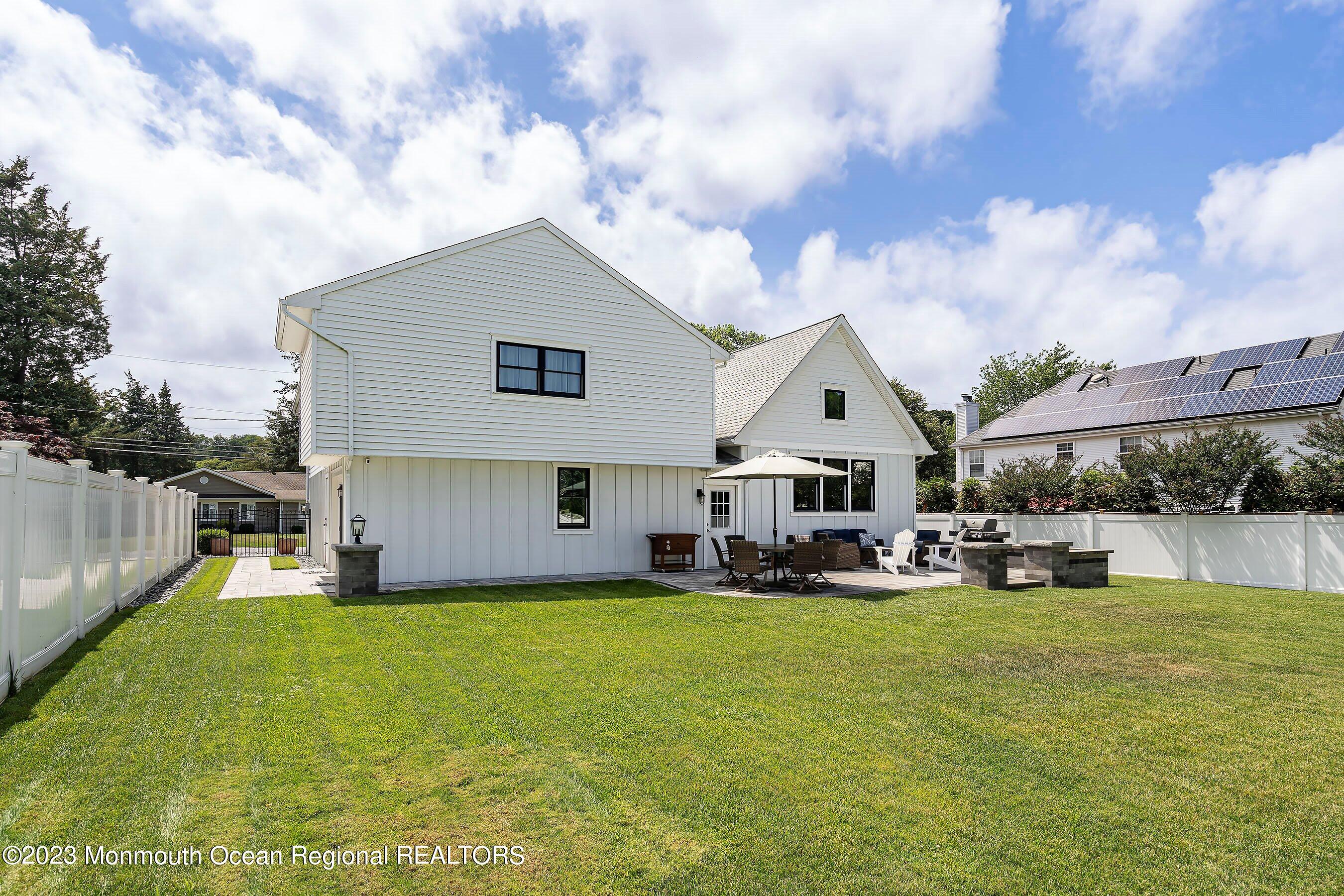 2502 Kipling Avenue Spring Lake, NJ 07762 - Photo 39 of 43 a large house with a big yard and large trees