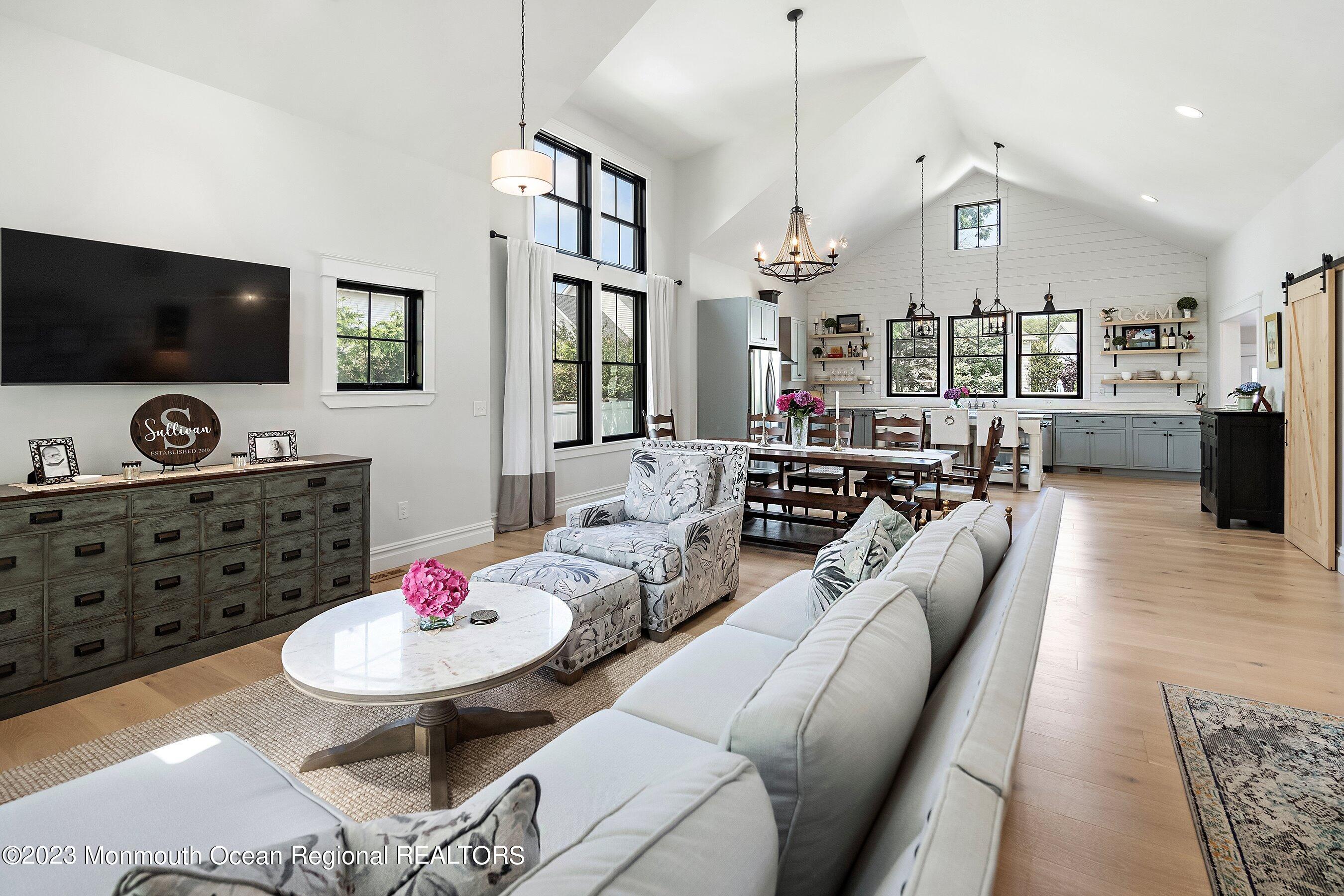 2502 Kipling Avenue Spring Lake, NJ 07762 - Photo 8 of 43 a living room with furniture kitchen view and a flat screen tv