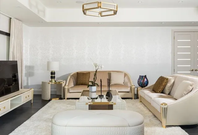 a living room with furniture and a floor to ceiling window
