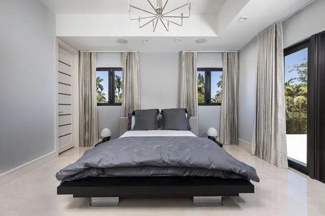 a bathroom with a sink mirror and a shower