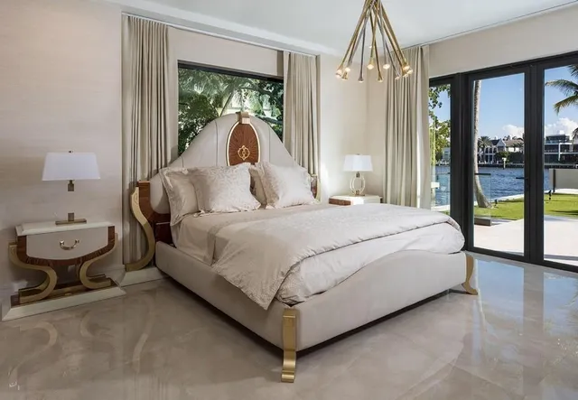 a bathroom with a tub a sink and mirror