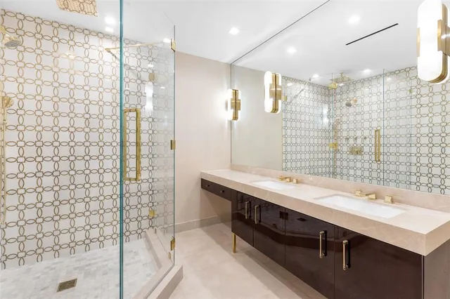 a spacious bedroom with a bed mirror and window