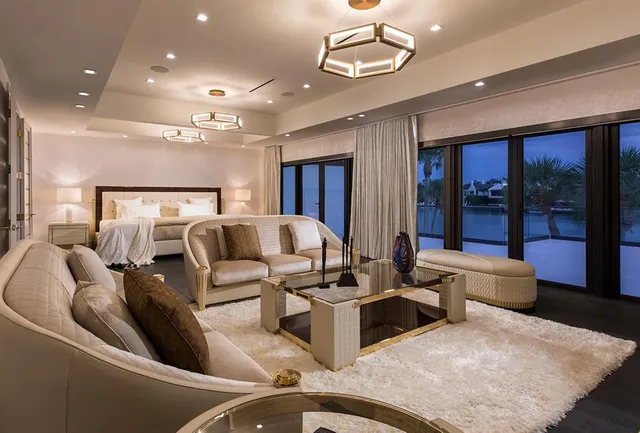 a view of a patio with couches and pool