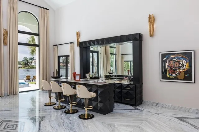 a large kitchen with a table and chairs