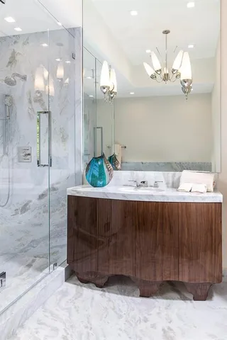 a view of swimming pool with lake view and trees in the background