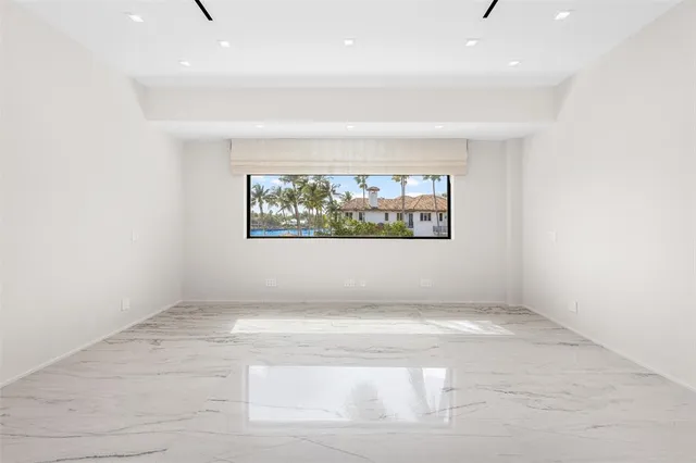 an aerial view of a house with garden space and lake view