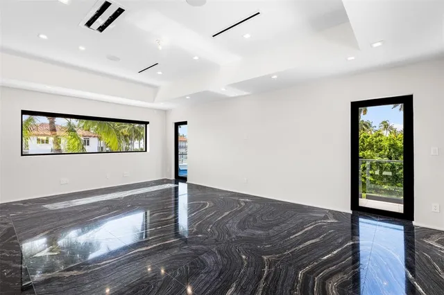 an aerial view of a house with a lake view