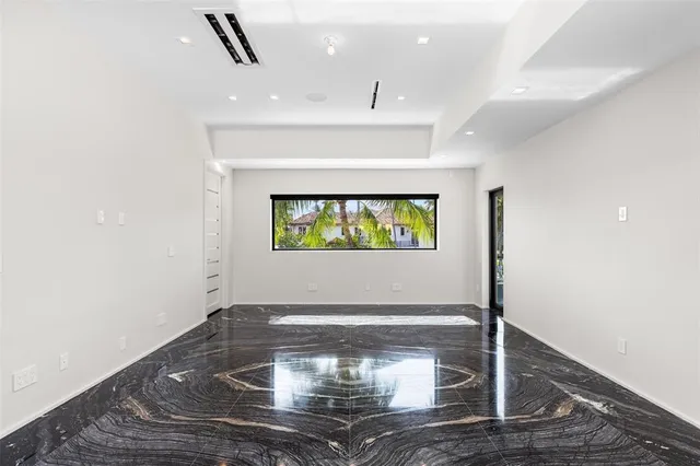 an aerial view of a house with a lake view