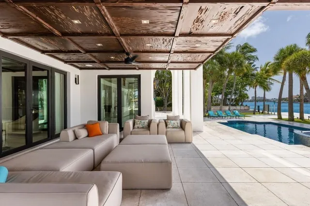 an aerial view of residential house with outdoor space and lake view