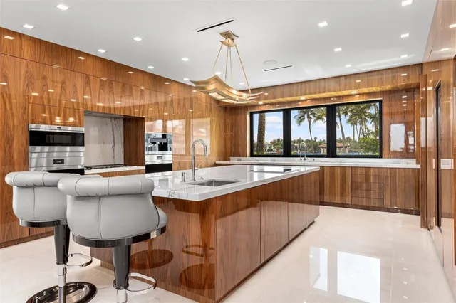a view of a living room with a floor to ceiling window and tree