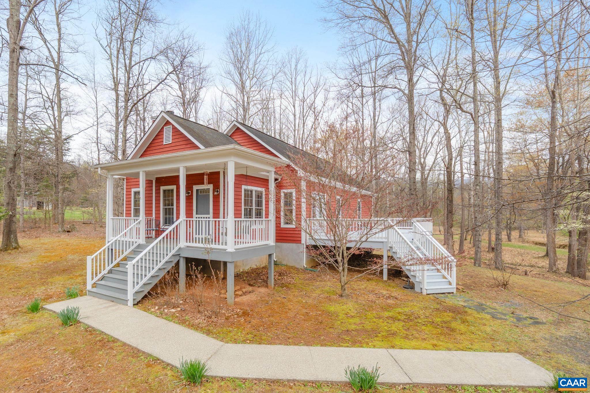500 Rhue Hollow Road Roseland, VA 22967 - Photo 1 of 34 a view of a house with backyard porch and sitting area