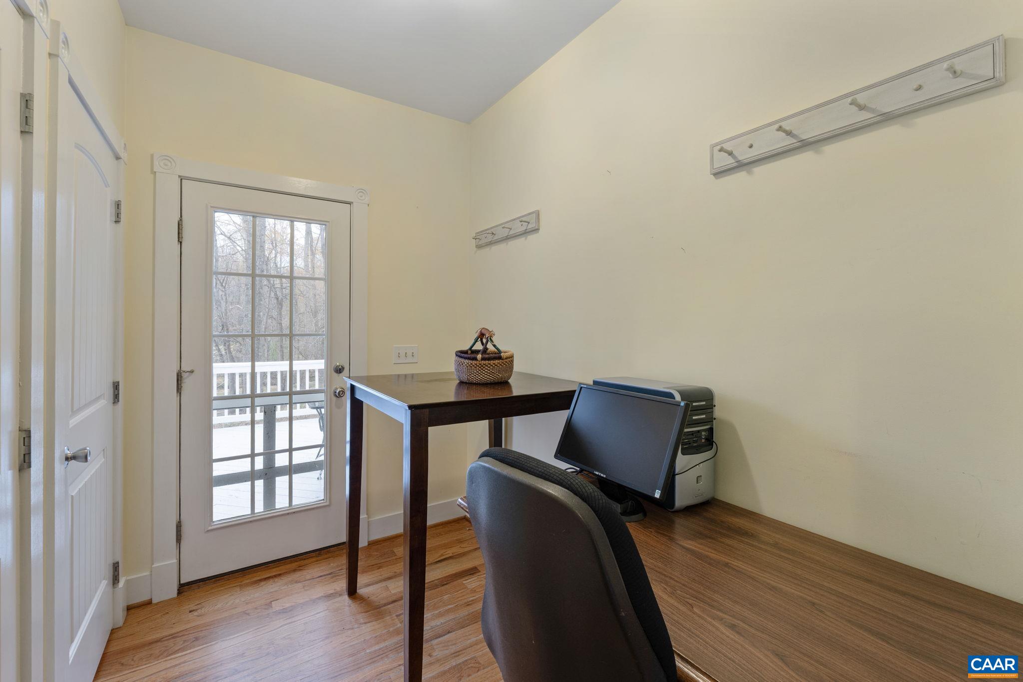 500 Rhue Hollow Road Roseland, VA 22967 - Photo 11 of 34 a view of workspace and wooden floor in a livingroom