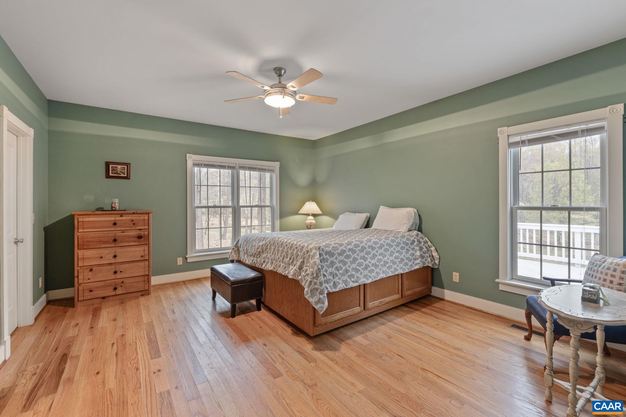 500 Rhue Hollow Road Roseland, VA 22967 - Photo 13 of 34 a bedroom with a bed and wooden floor
