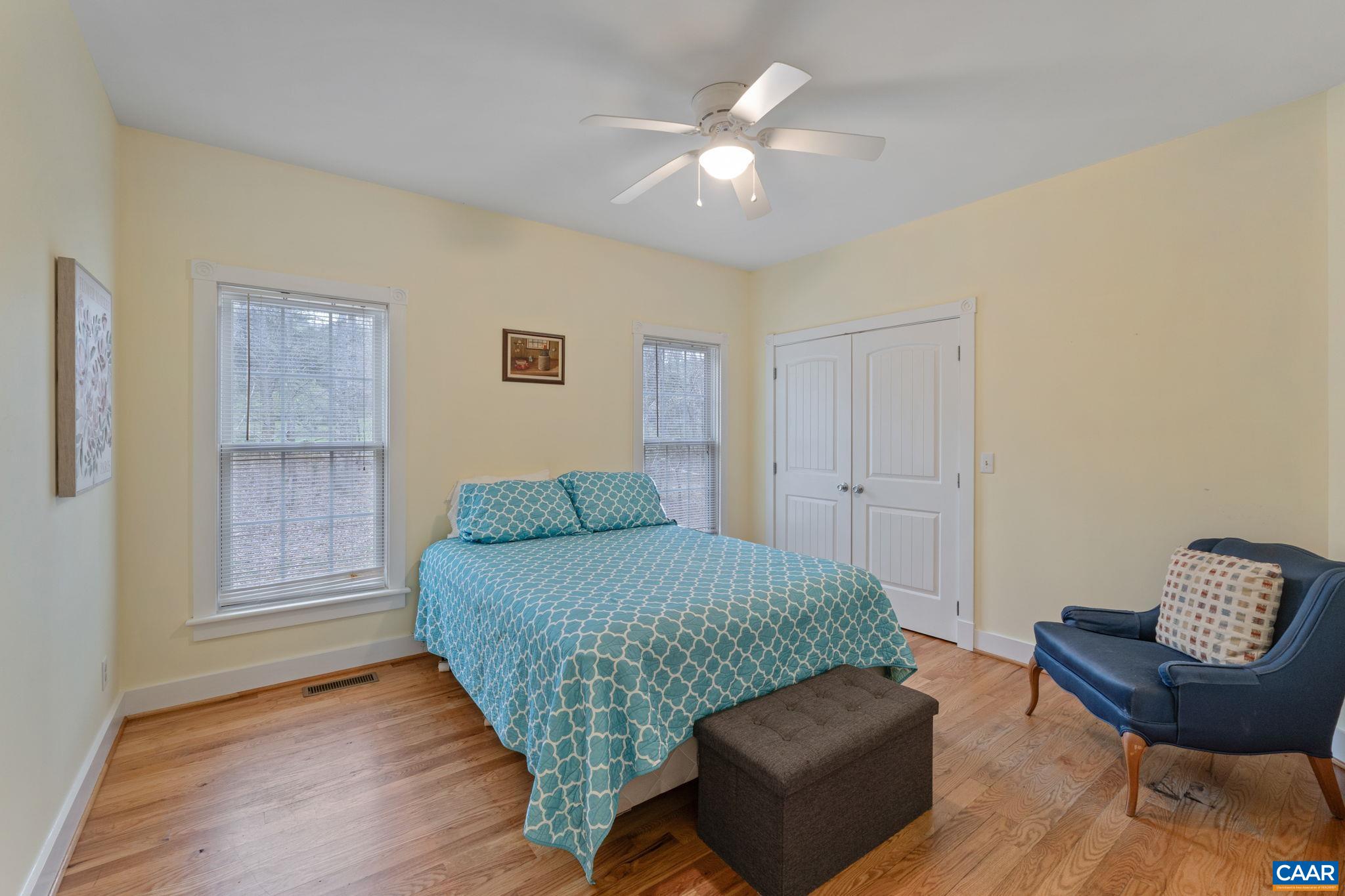 500 Rhue Hollow Road Roseland, VA 22967 - Photo 17 of 34 a living room with a bed furniture and a window