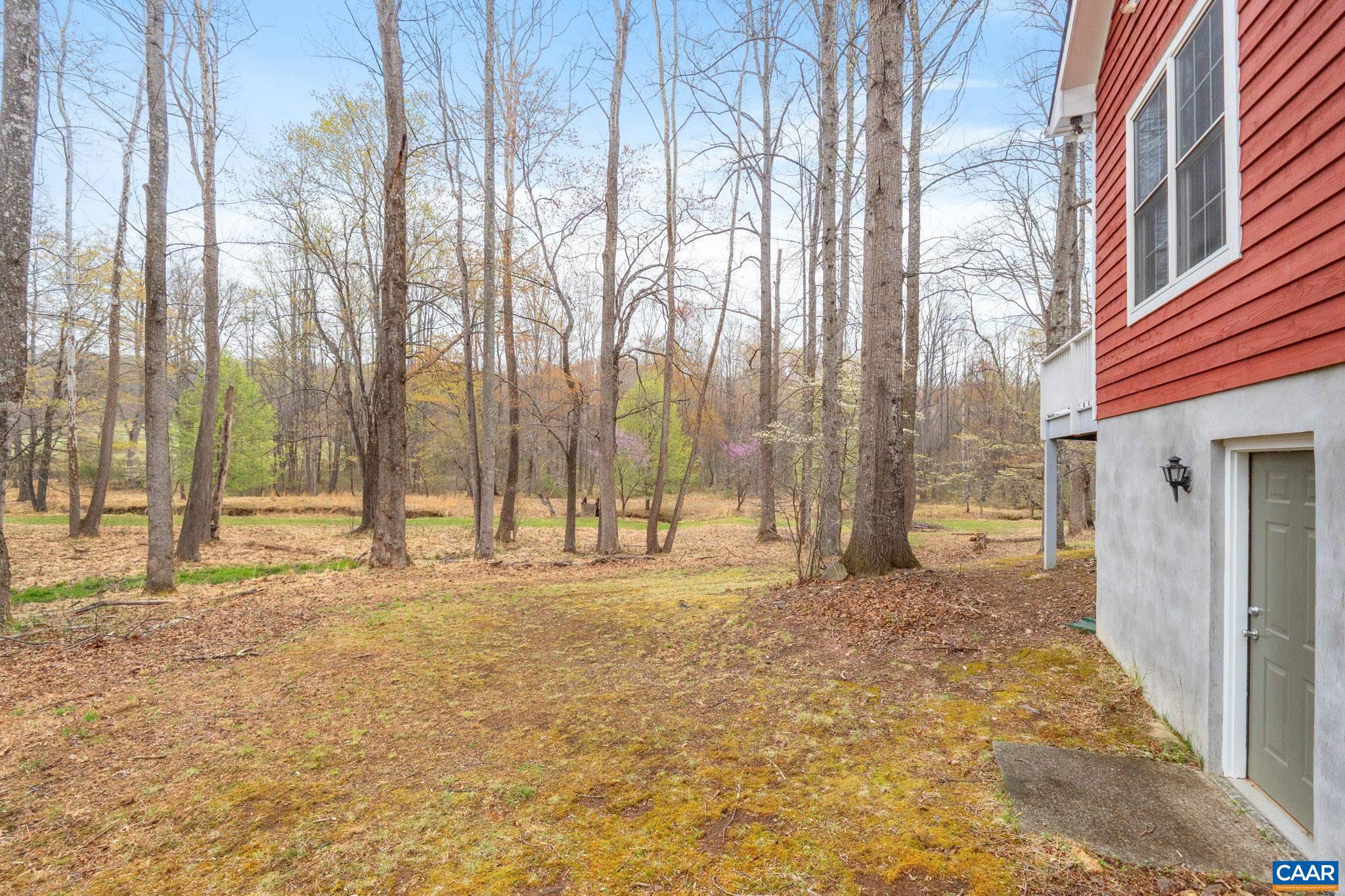 500 Rhue Hollow Road Roseland, VA 22967 - Photo 25 of 34 a view of a yard with large trees