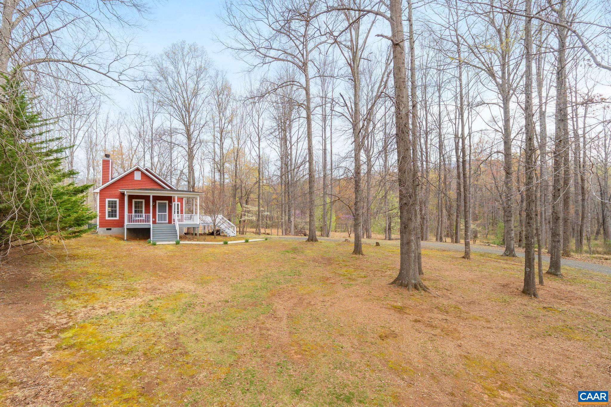 500 Rhue Hollow Road Roseland, VA 22967 - Photo 27 of 34 a house with trees in front of it