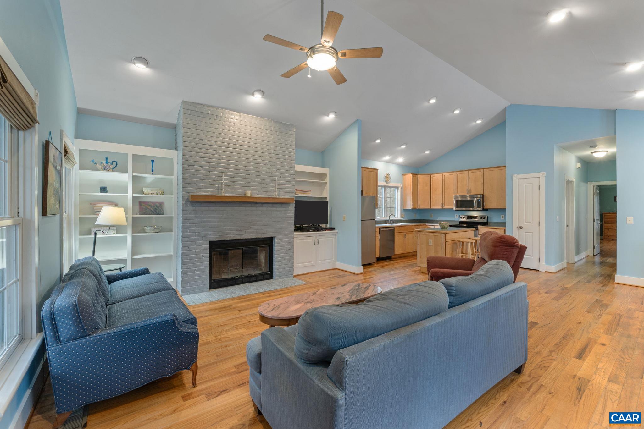 500 Rhue Hollow Road Roseland, VA 22967 - Photo 3 of 34 a living room with furniture and a fireplace