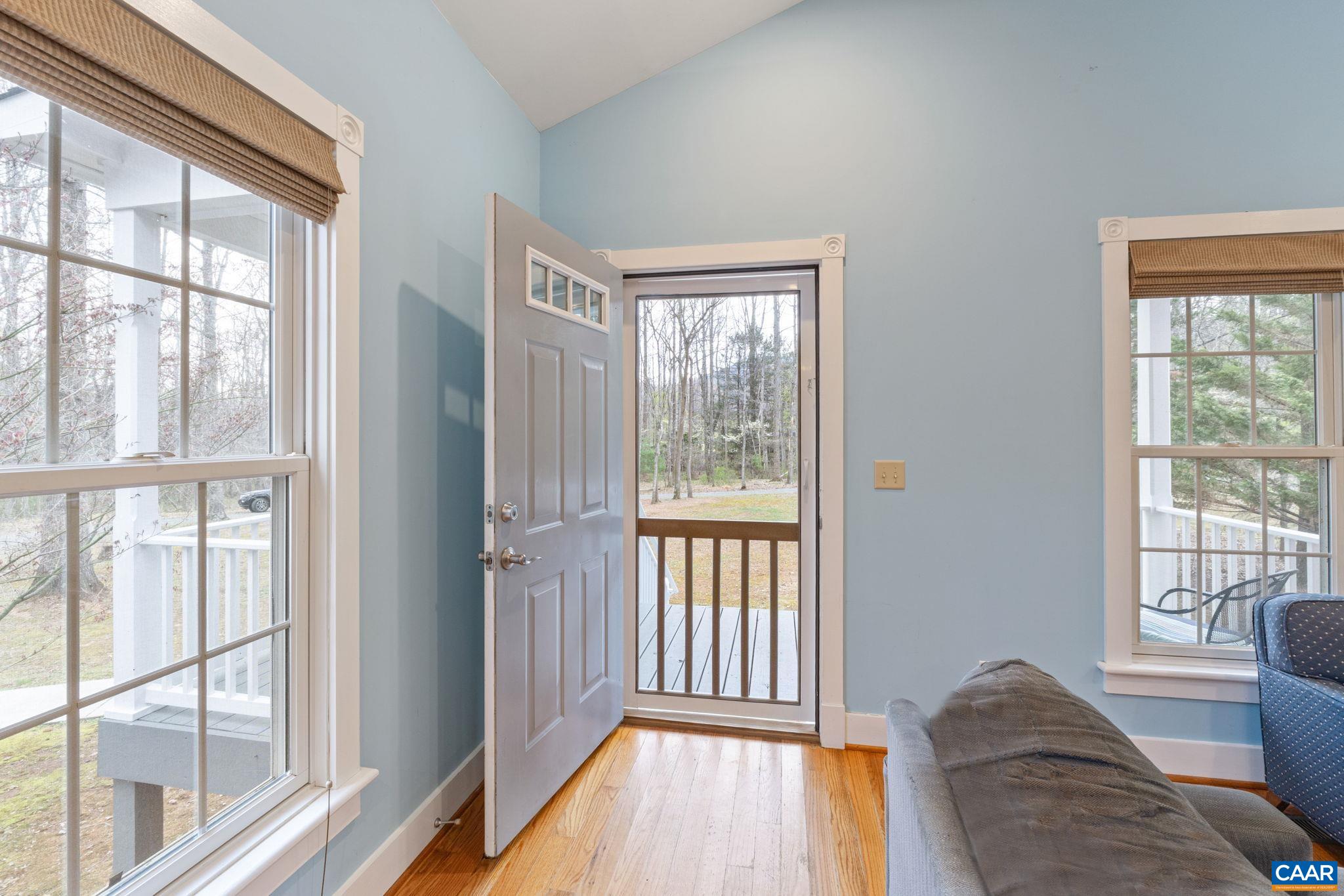 500 Rhue Hollow Road Roseland, VA 22967 - Photo 5 of 34 a view of a livingroom with wooden floor and a large window