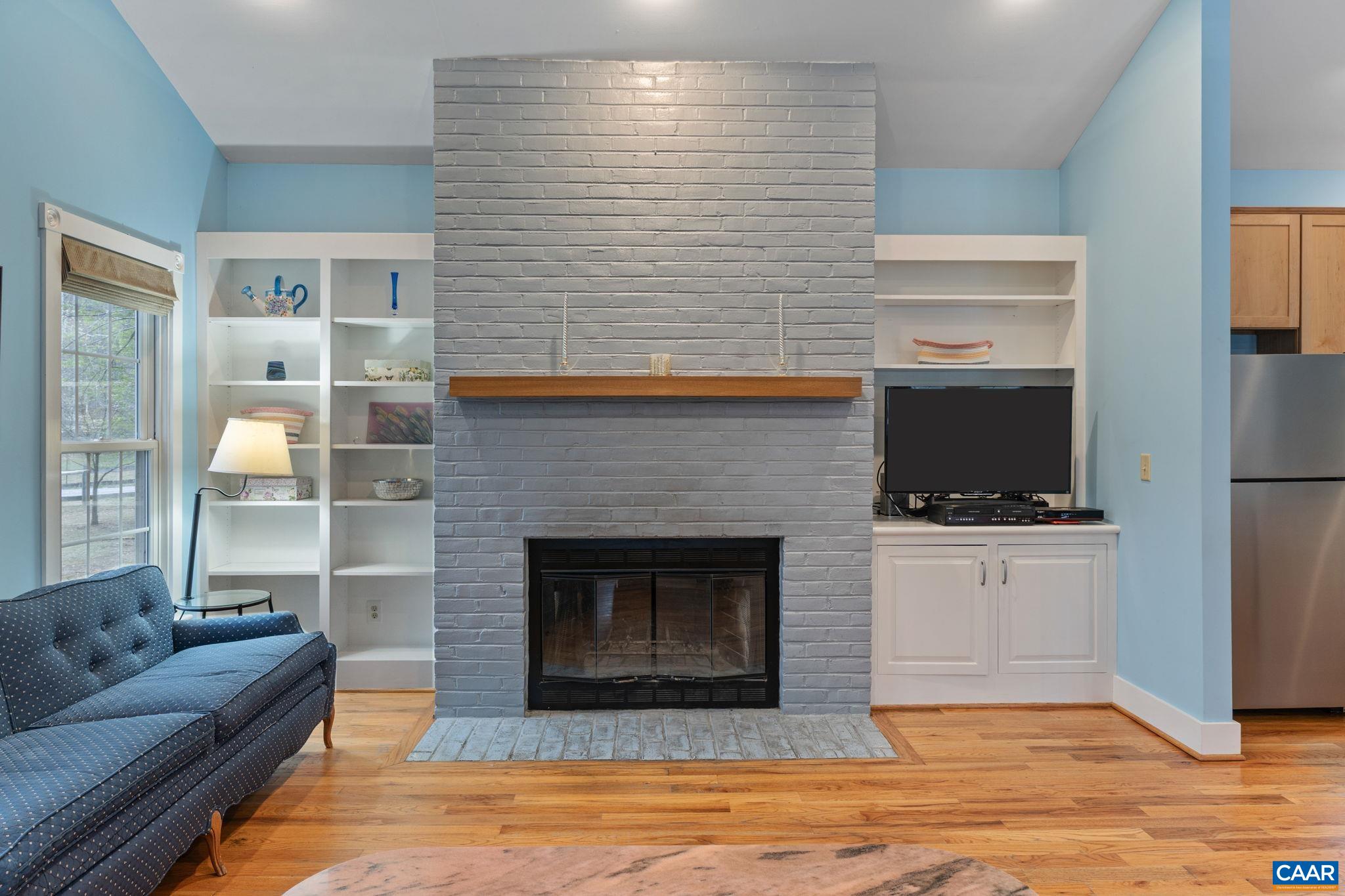 500 Rhue Hollow Road Roseland, VA 22967 - Photo 6 of 34 a living room with furniture and a fireplace