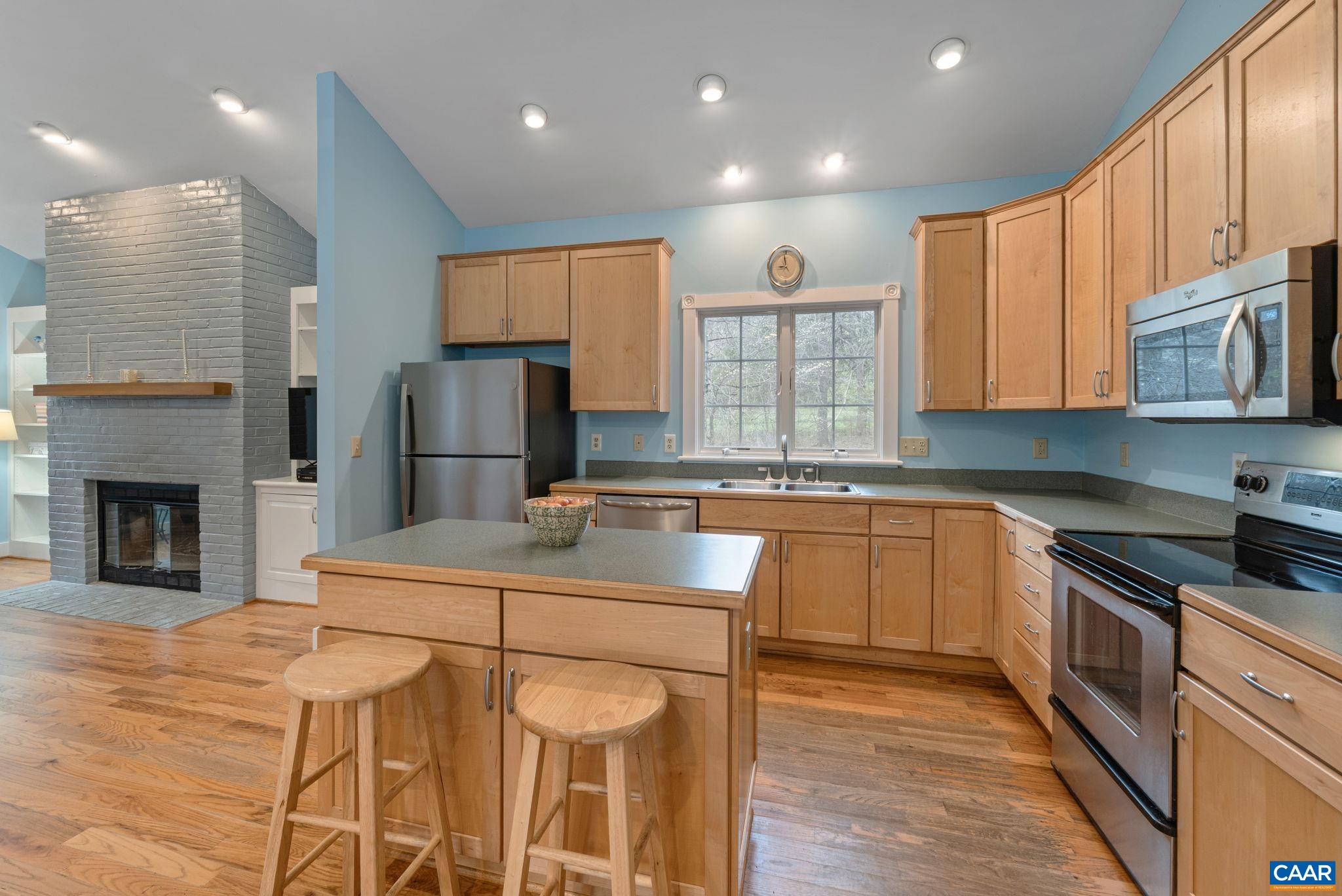 500 Rhue Hollow Road Roseland, VA 22967 - Photo 7 of 34 a kitchen with stainless steel appliances granite countertop a refrigerator a stove top oven a sink and dishwasher