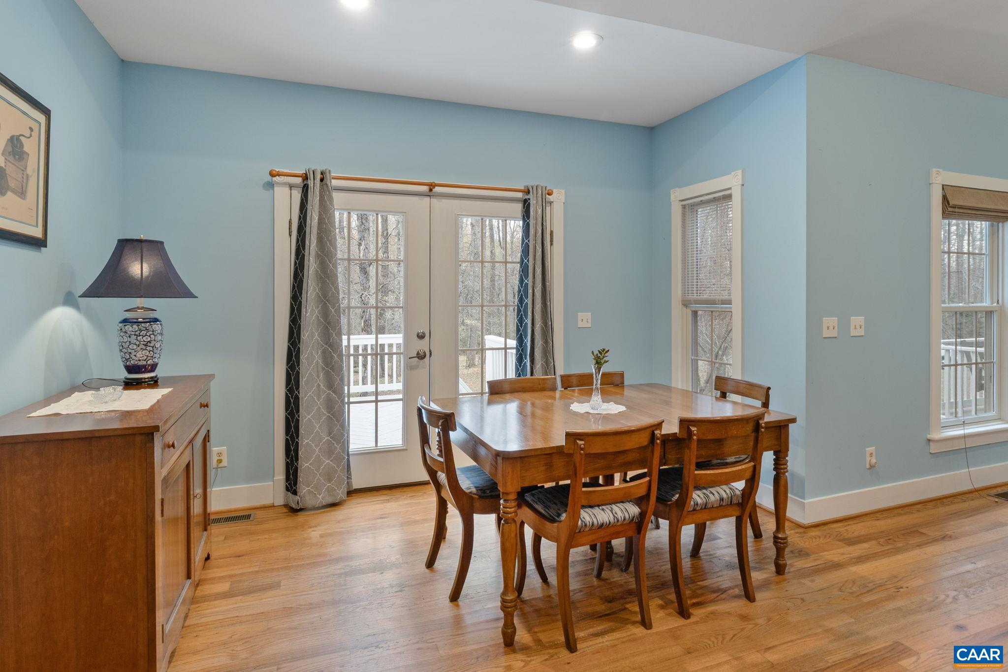 500 Rhue Hollow Road Roseland, VA 22967 - Photo 9 of 34 a dining room with furniture and wooden floor