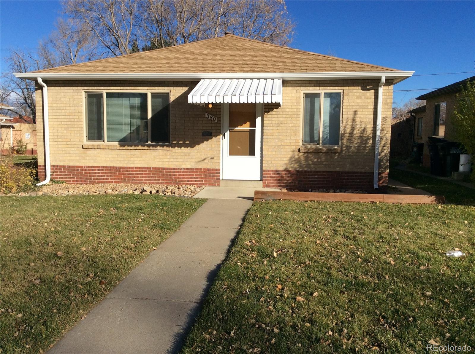 a front view of a house with yard