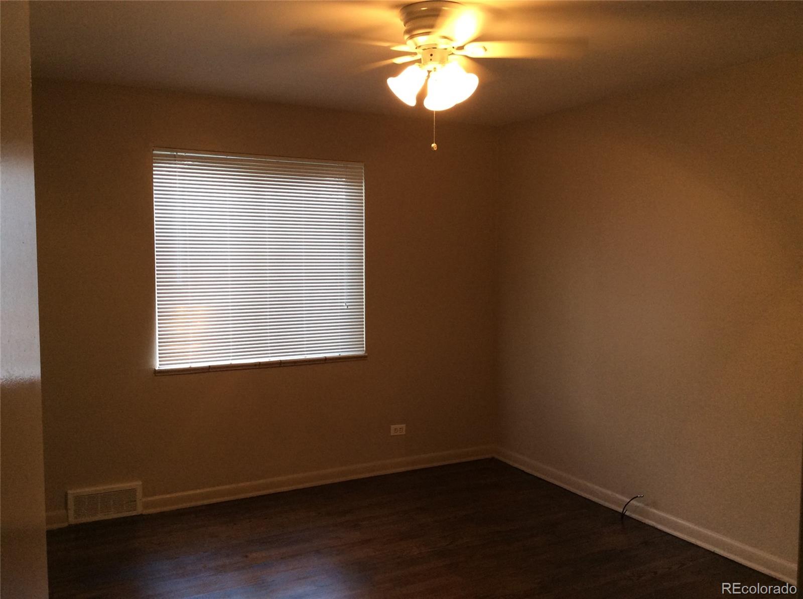 380 South Decatur Street Denver, CO 80219 - Photo 8 of 12 an empty room with a window