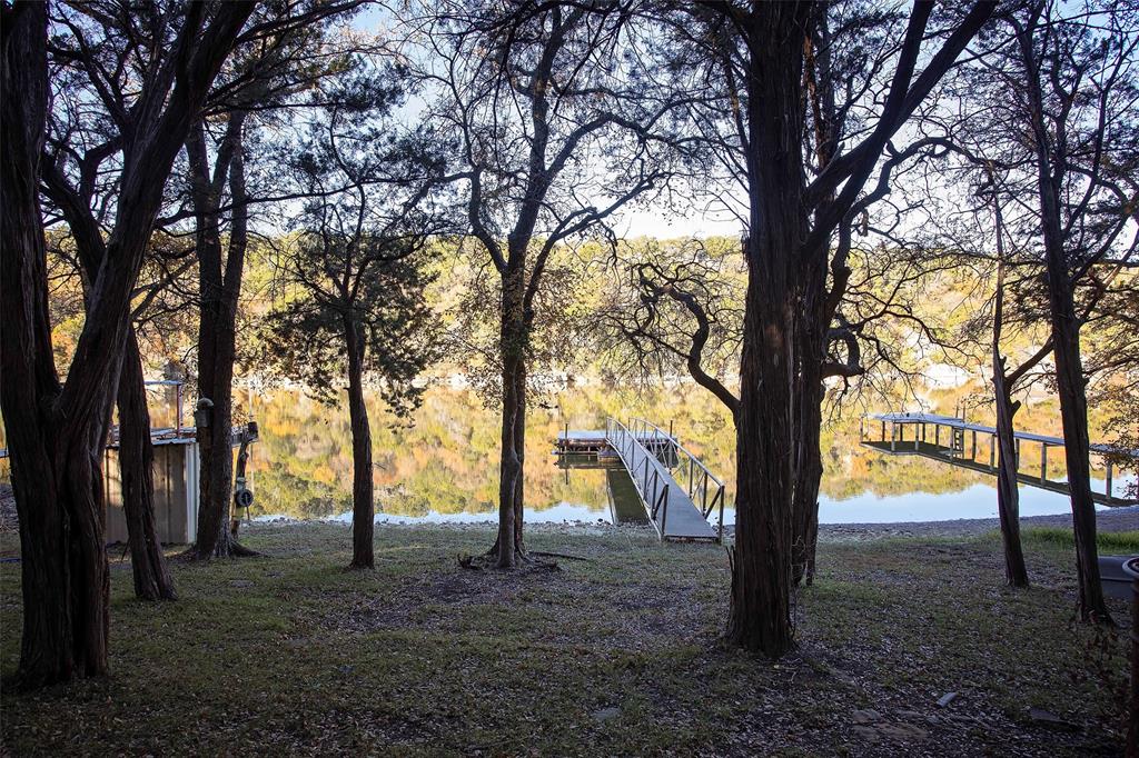 9051 Lacy Road Graford, TX 76449 - Photo 19 of 23 a view of trees with a tree in the background