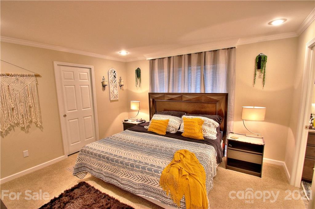 43 Janie Road, Unit 14 Clyde, NC 28721 - Photo 13 of 35 a bedroom with a bed and a cabinets