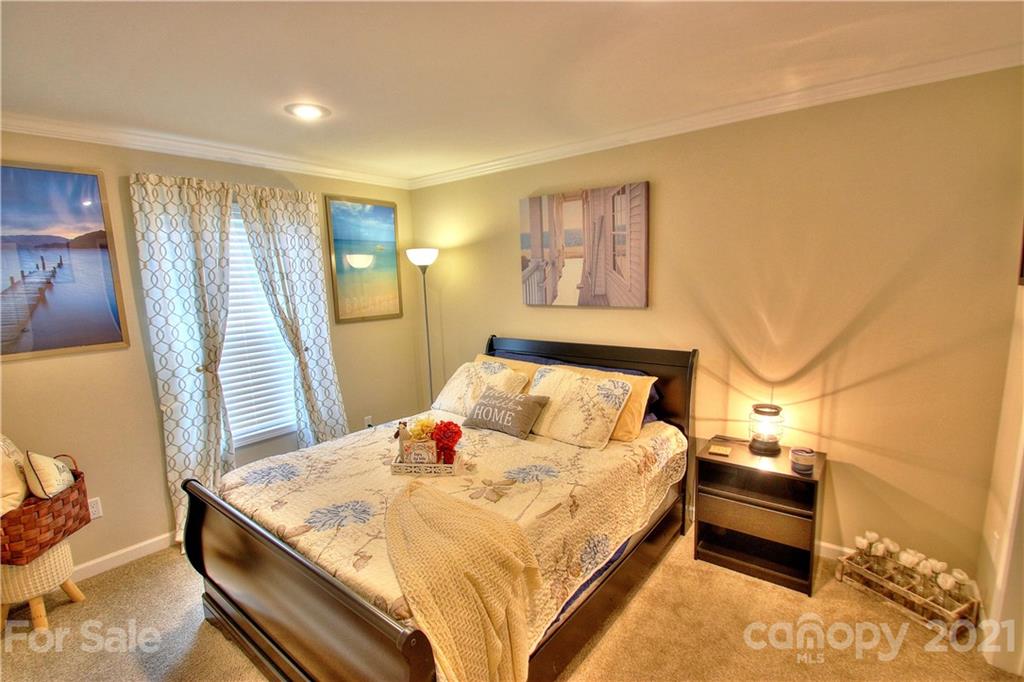 43 Janie Road, Unit 14 Clyde, NC 28721 - Photo 17 of 35 a bedroom with a bed and wooden floor
